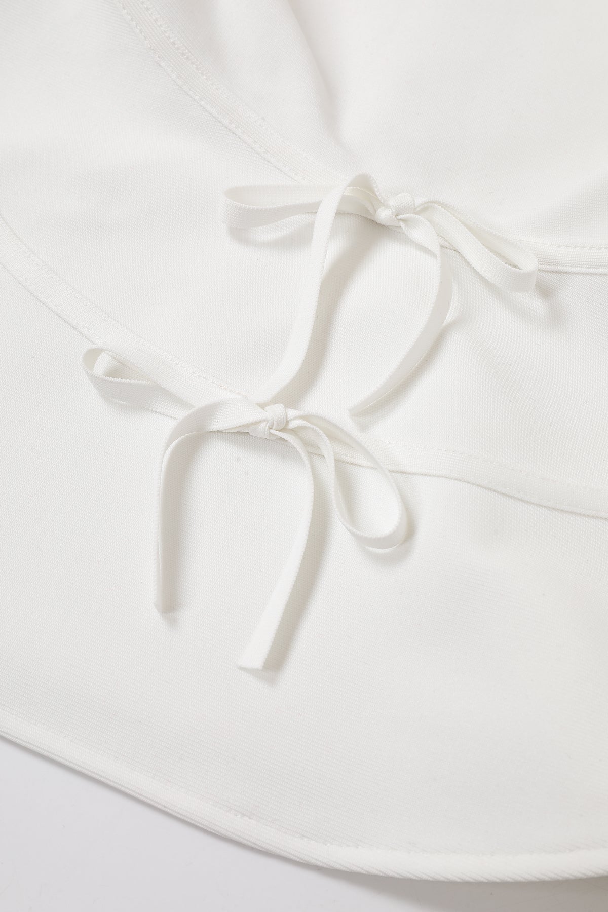 Isabeau Bandage Sleeveless Peplum Top with Bows